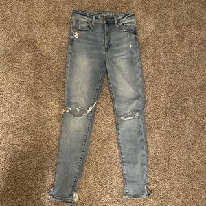 Size 6, SUPER STRETCH distressed light wash jeans.